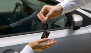 woman receiving car key from man